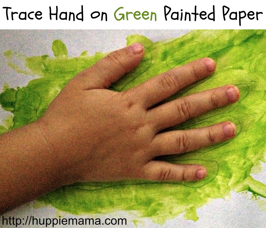 Trace Hand on Green Painted Paper