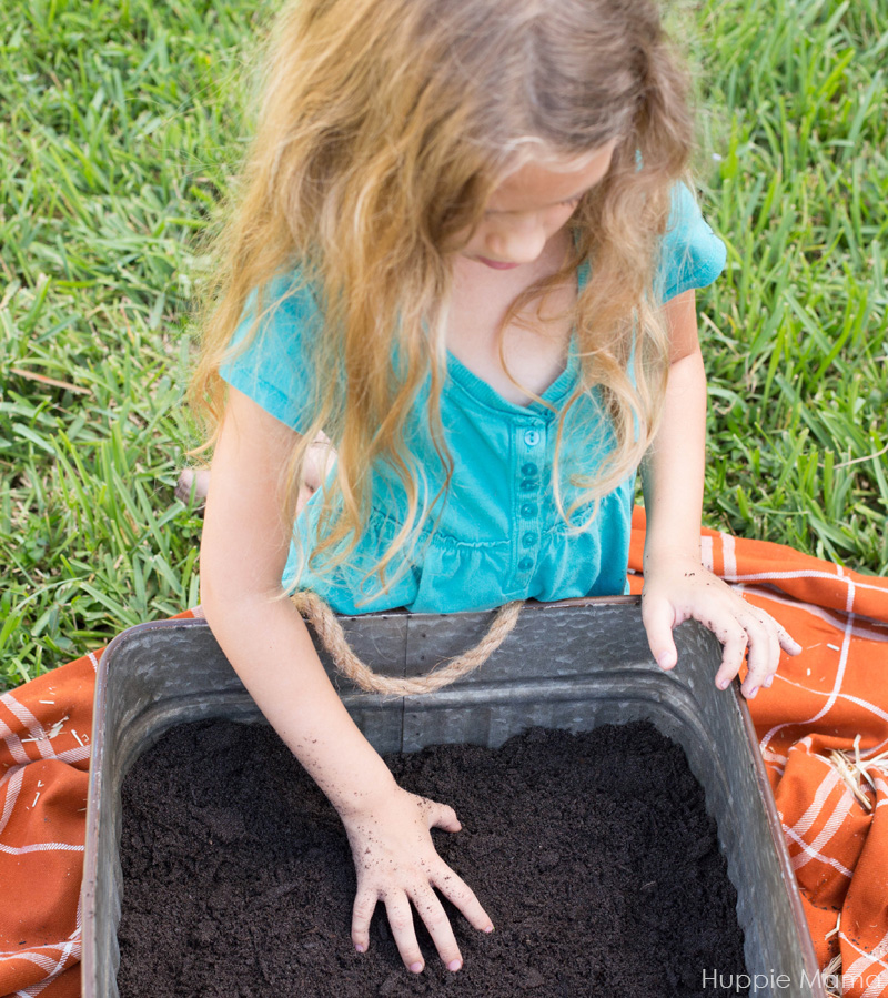 girl digs soil